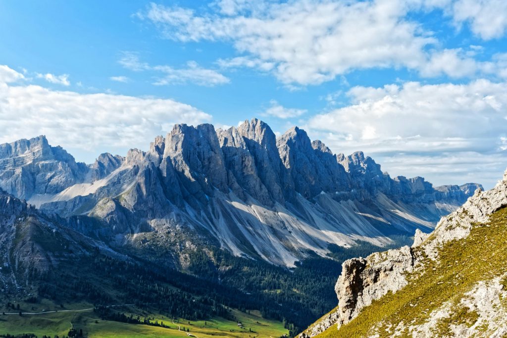 A breathtaking view of a majestic mountain range under a clear blue sky, perfect for nature enthusiasts.